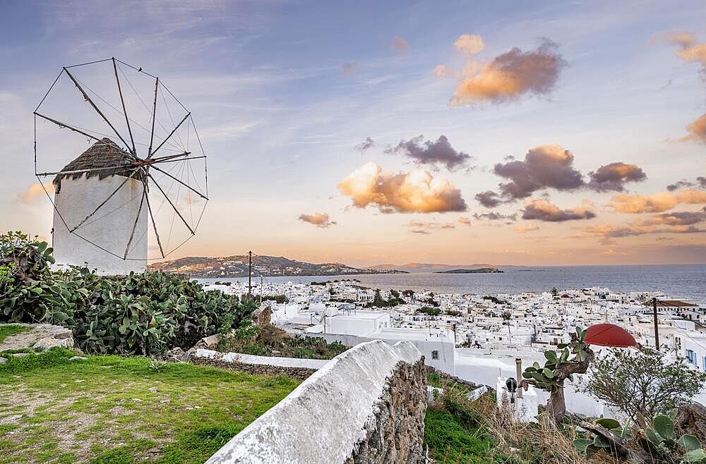 Bonis windmill at sunrise, view over white Cycladic houses, island and sea, Mykonos town, Mykonos, Cyclades, Greece, Europe