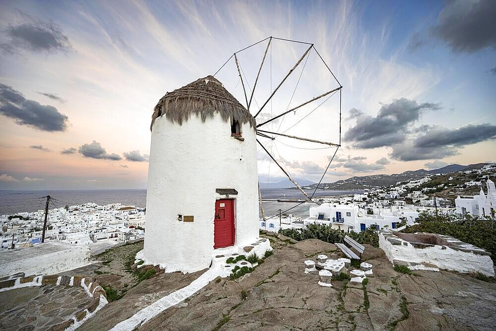 Bonis windmill at sunrise, view over white Cycladic houses, island and sea, Mykonos town, Mykonos, Cyclades, Greece, Europe