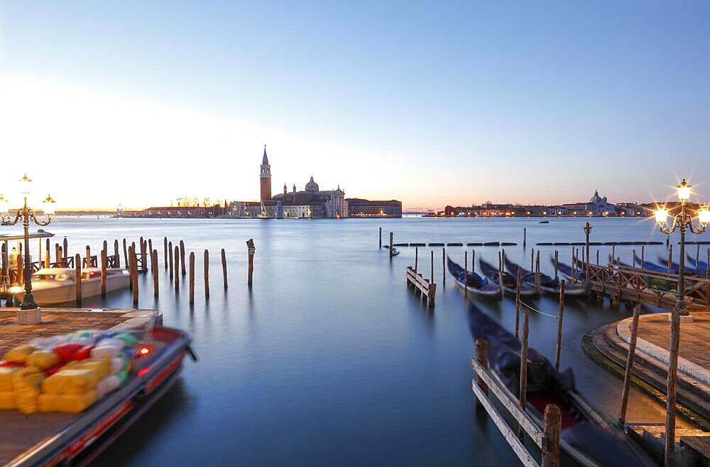 Moored gondolas at the Bacino di San Marco with the church of San Giorgio Maggiore, Venice, Veneto, Italy, Europe