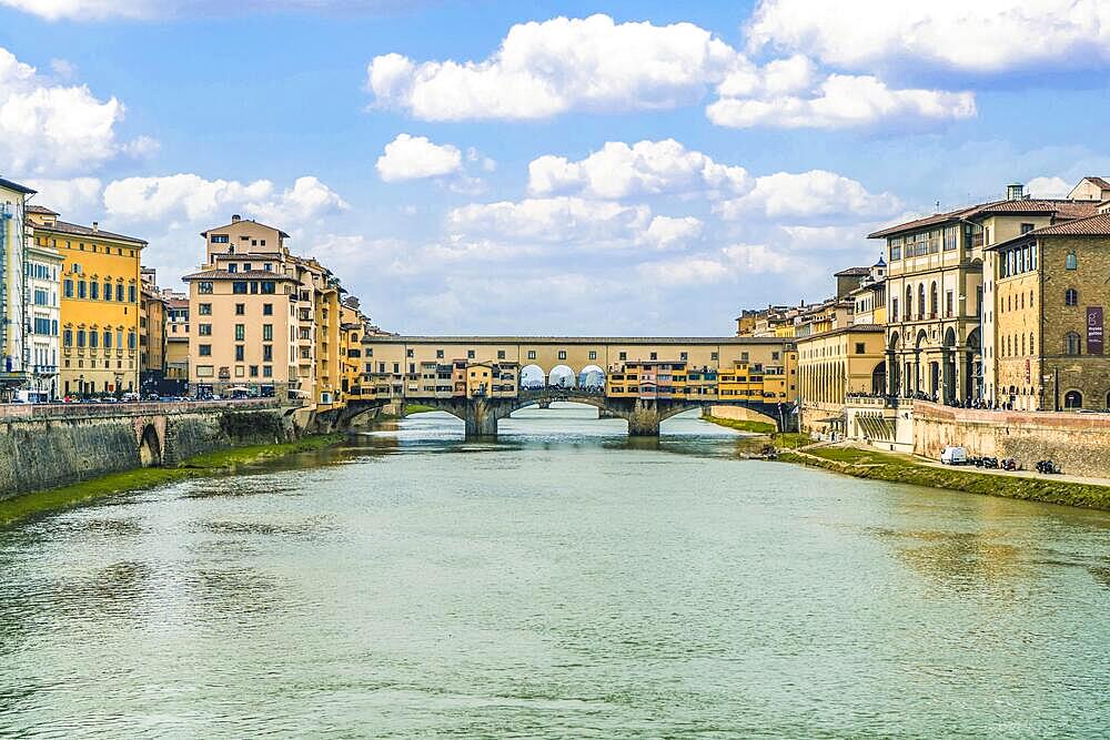 View of the iconic Ponte Vecchio, over the Arno River, in Florence, Italy, Europe