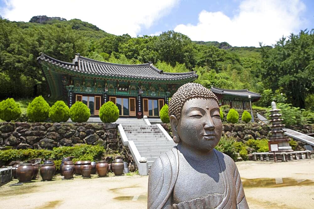 Buddha statue, in the back the Chunjinam Hermitage at Baekyangsa Temple, main temple of the Jogye Order of Korean Buddhism, Bukha-myeon, Jangseong, South Jeolla Province, South Korea, Asia