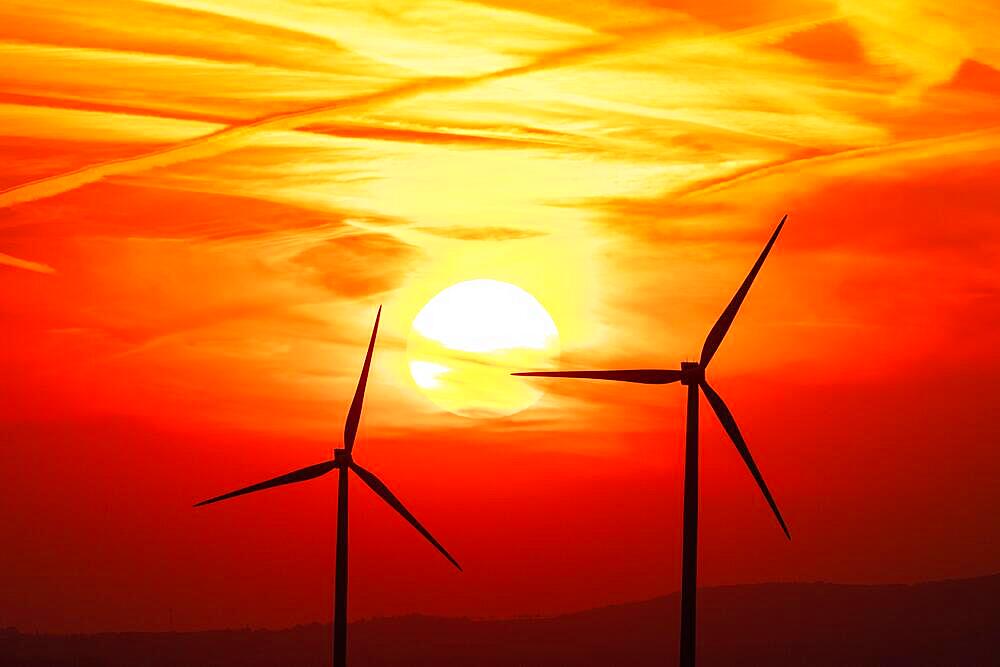 Wind turbine against the sunset in the Harz Mountains