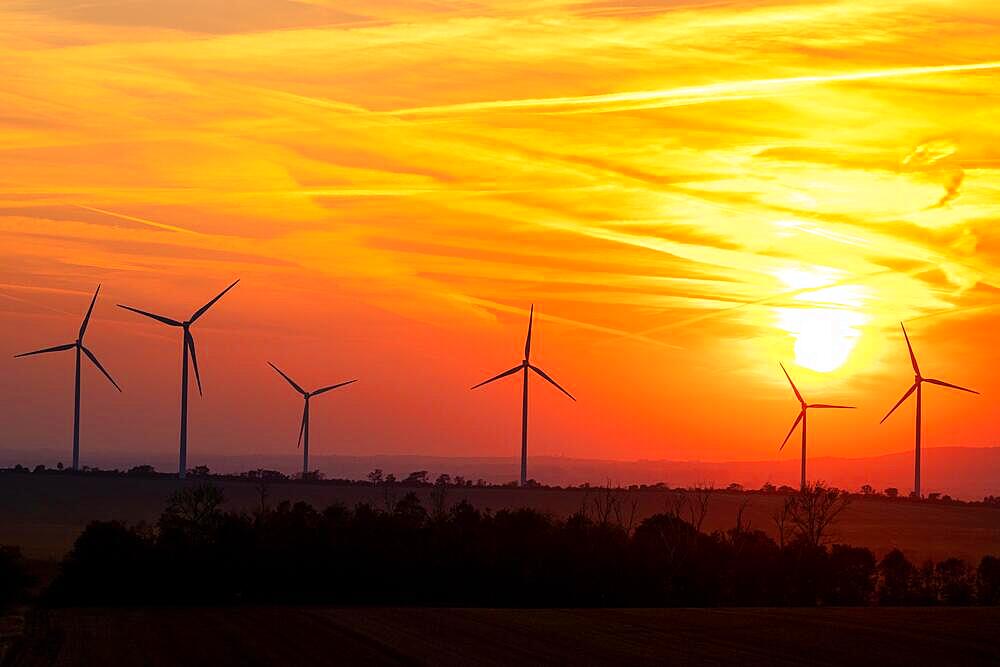 Wind turbine against the sunset in the Harz Mountains