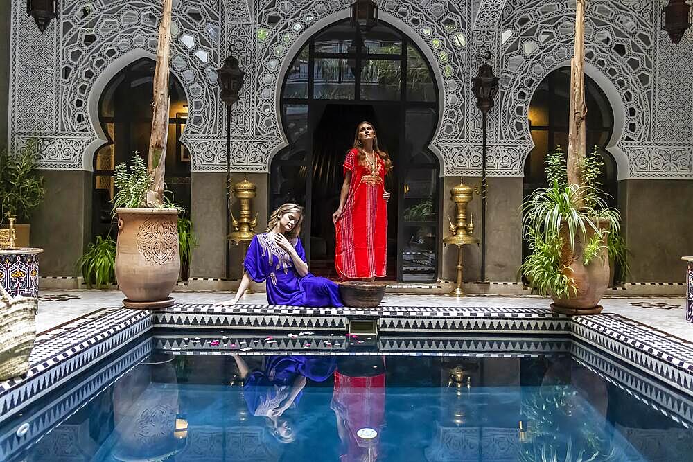 A gorgeous model poses inside a home environment in Medina, Morocco, Africa