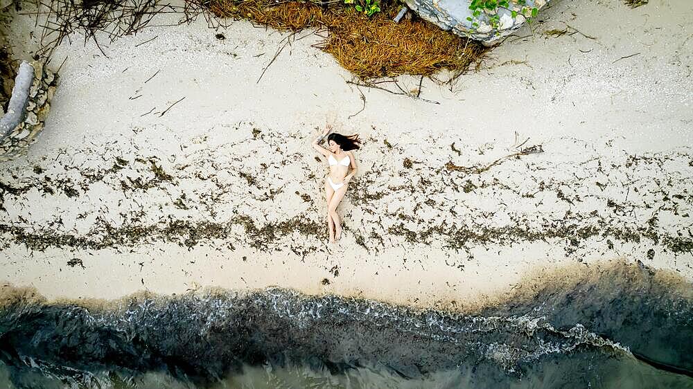 A gorgeous latin model enjoys the beach near the Gulf of Mexico near Sinanche Yucatan Mexico