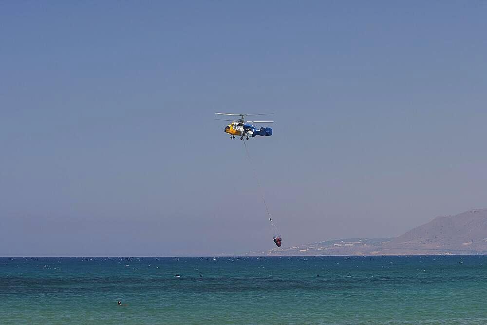 Helicopter, helicopter, fire-fighting helicopter, fire, helicopter close above the water surface, Georgioupolis, Crete, Greece, Europe