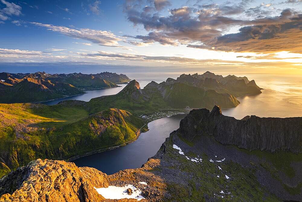 View over Senja's fjords and mountain peaks under the midnight sun, Mount Grytetippen, Senja, Norway, Europe