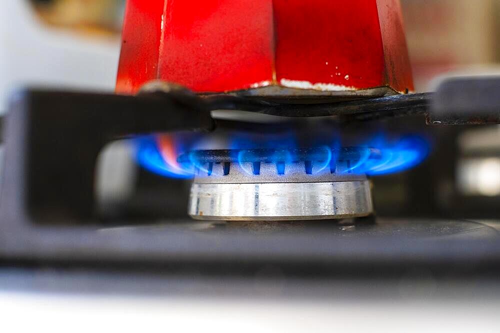 Espresso maker over a flame on a gas cooker