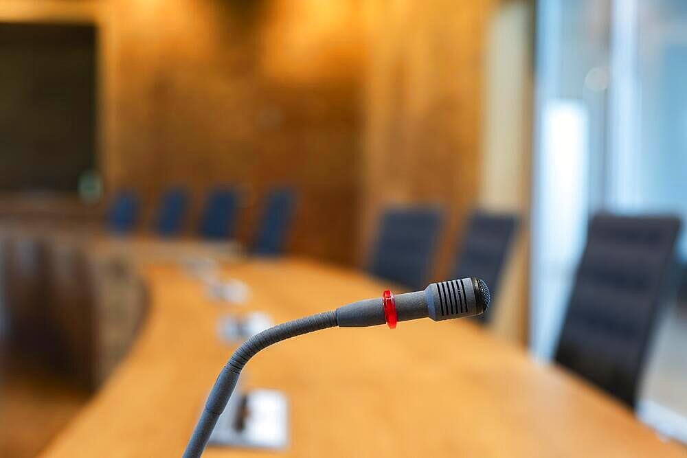 Close-up of a microphone in a meeting room