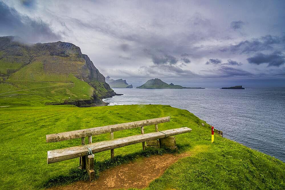 Bench overlooking over Gasadalur, Vagar, Faroe islands, Denmark, Europe