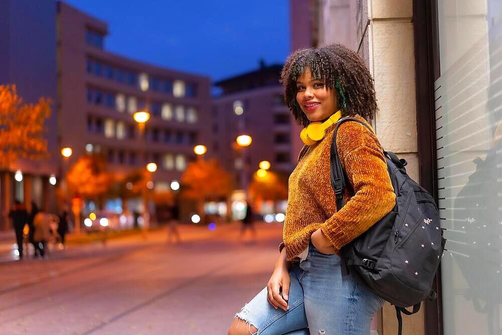 Portrait of black ethnic girl smiling early in the morning going to college on back to school