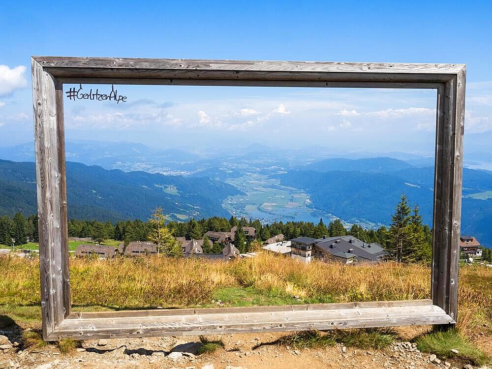 Wooden frame as photo motif, view from Gerlitzen Alpe towards Feuerberg and Ossiachersee, Gerlitzen Alpe, Carinthia, Austria, Europe