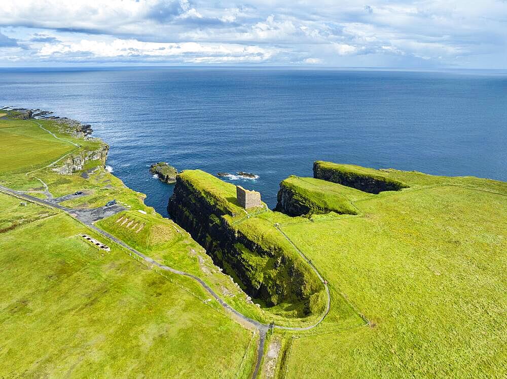 Aerial view of the ruined Castle of Old Wick surrounded by rugged cliffs on the North Sea coast, Wick, County Caithness, Scotland, United Kingdom, Europe