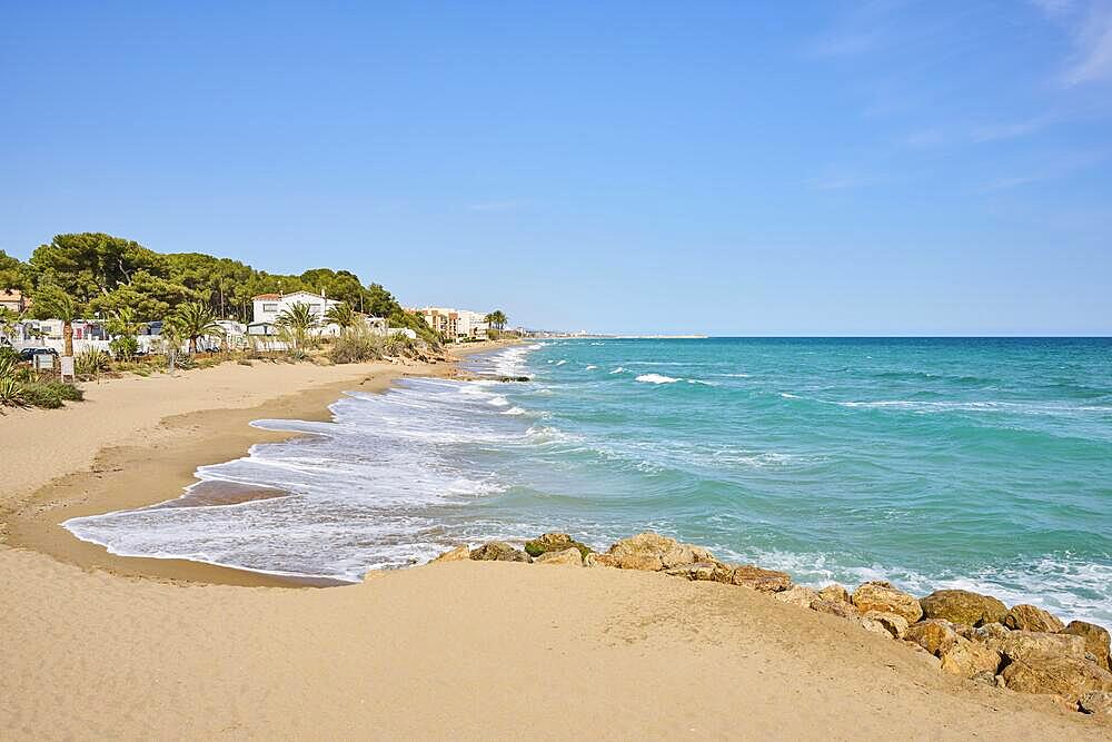 Breaking waves on a sandy beach, sunny, near Tarragona, Catalonia, Spain, Europe