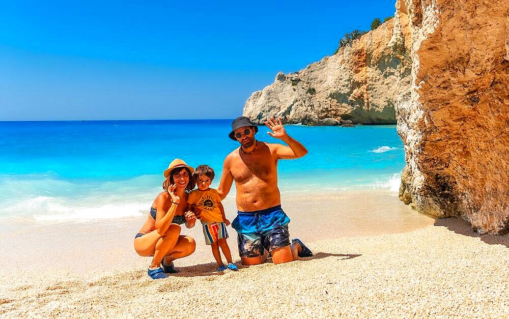 Portrait of a family having fun on Porto Katsiki beach in Lefkada island on vacation, Greece, Europe