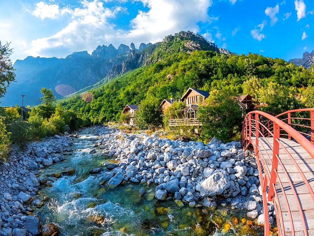 Red bridge along the river of Valbona Valley, Theth National Park, Albanian Alps, Albania, Europe