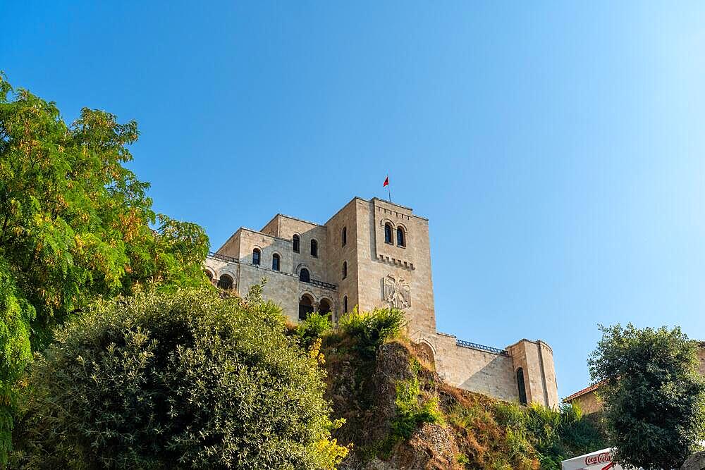 View from below of Kruje Castle and its fortress with the walls. Albania