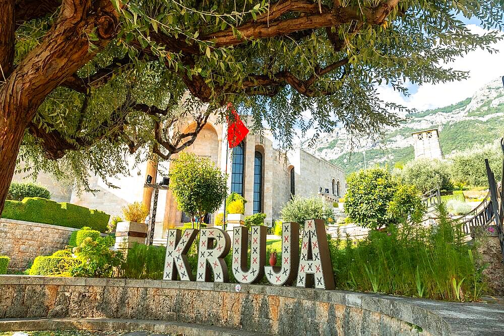 Kruja lettering on Kruje Castle and its fortress with walls. Albania