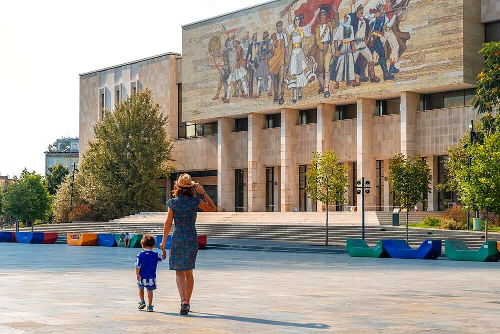 A mother with her son visiting the National Historical Museum in Skanderbeg Square in Tirana. Albania