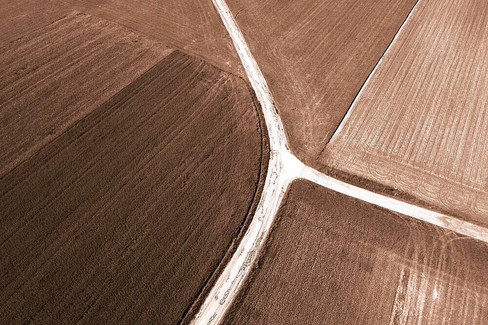 Drone shot, sepia, agricultural landscape, field path with crossroads leads through meadows and fields, Lochen, Innviertel, Upper Austria, Austria, Europe