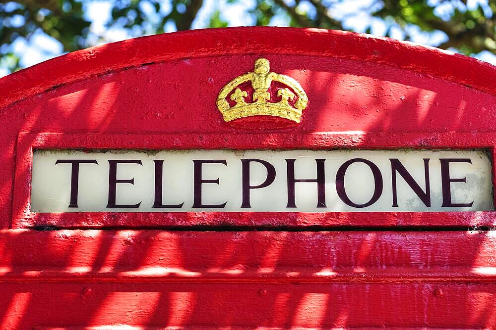 Red telephone box, lettering Telephone, close-up, St Martin's, Isles of Scilly, Cornwall, England, Great Britain