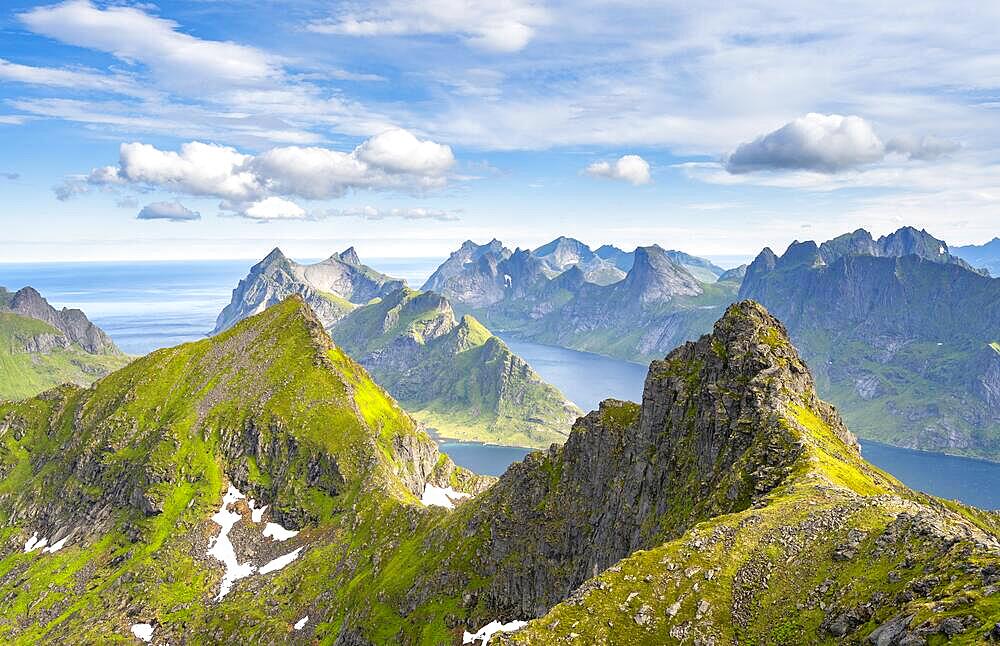 Mountain landscape with steep rocky peaks fjords and sea, view from the top of Munken to Reinefjorden, Moskenesoya, Lofoten, Nordland, Norway, Europe