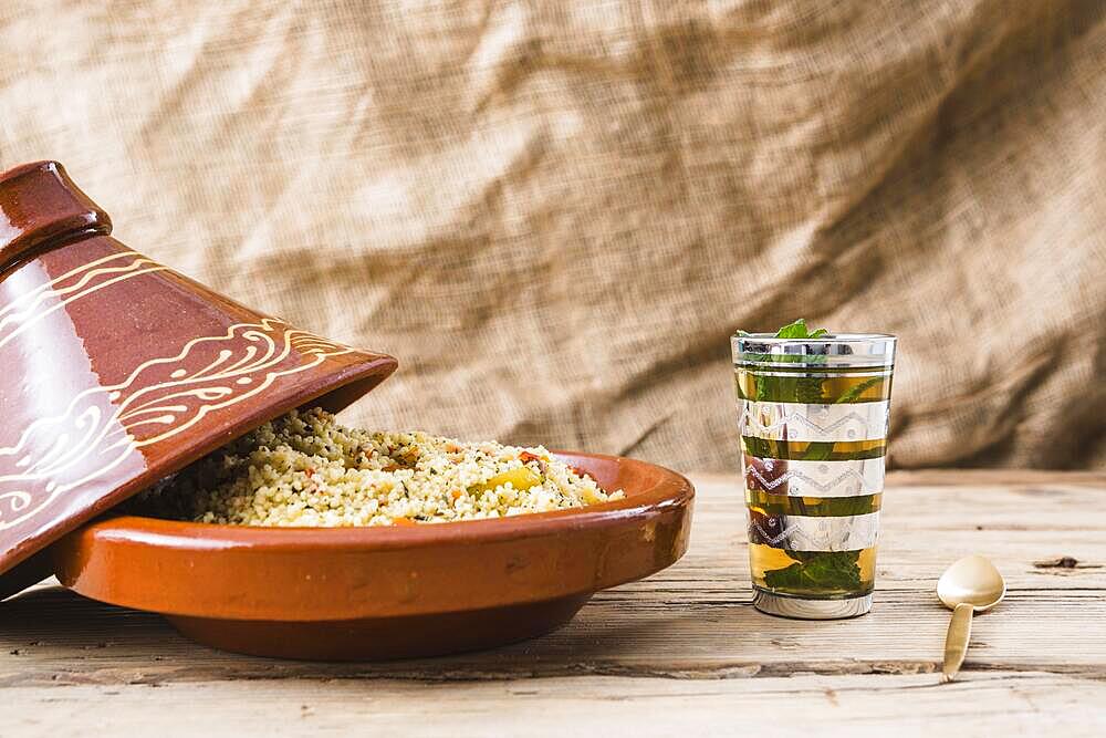 Quinoa salad near cup table