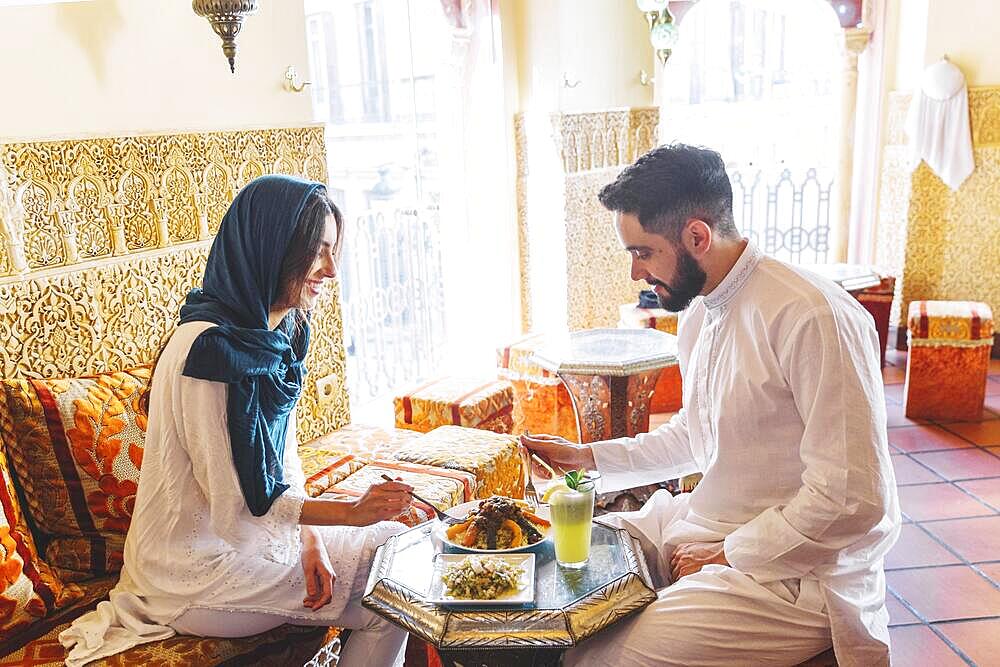 Modern muslim couple arab restaurant