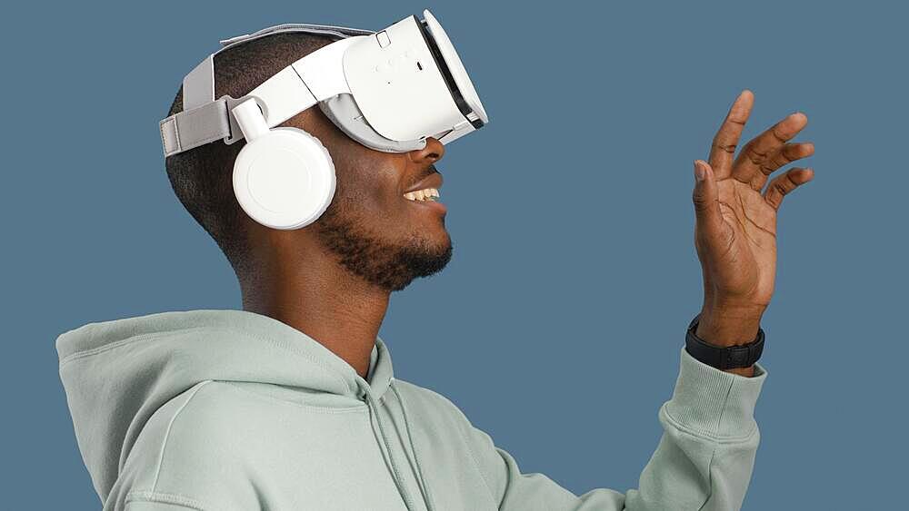 Side view smiley man with virtual reality headset