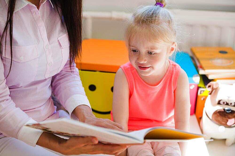 Girl listening story with interest