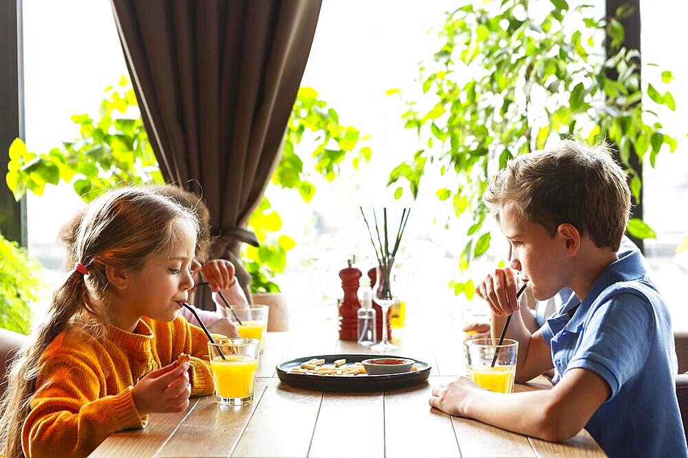 Kids drinking juice