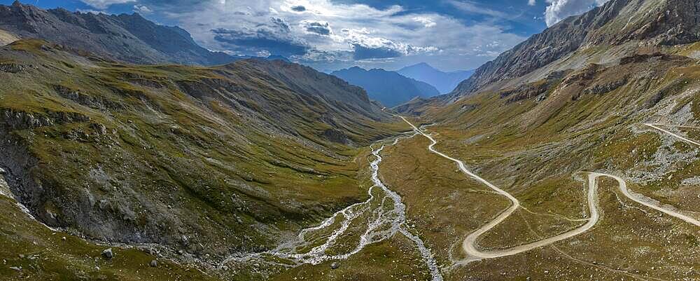 Ascent to Colle Sommeiller, also Col du Sommeiller, Mont-Cenis massif, Rough gravel road in the Piedmont Alps, Italian-French border area, Bardonecchia, Piedmont, Italy, Europe