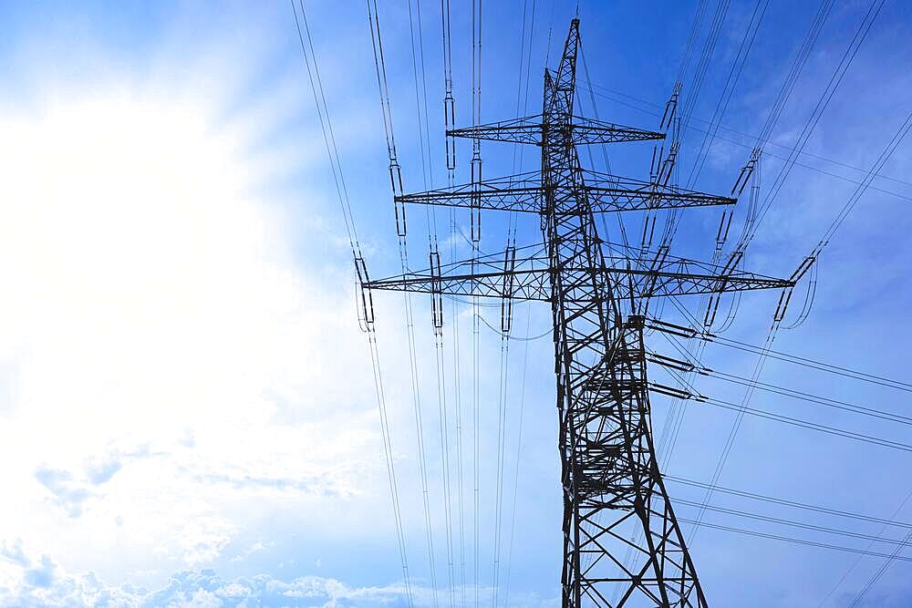 Power pylons, sun, Baden-Wuerttemberg, Germany, Europe