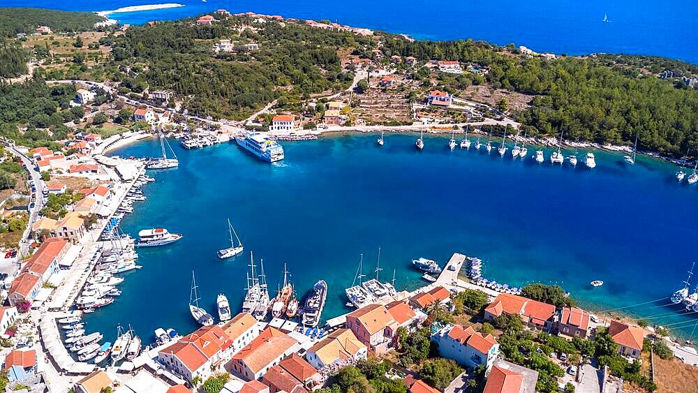 Aerial drone panorama of Fiskardo village port on Kefalonia island, Greece, Europe