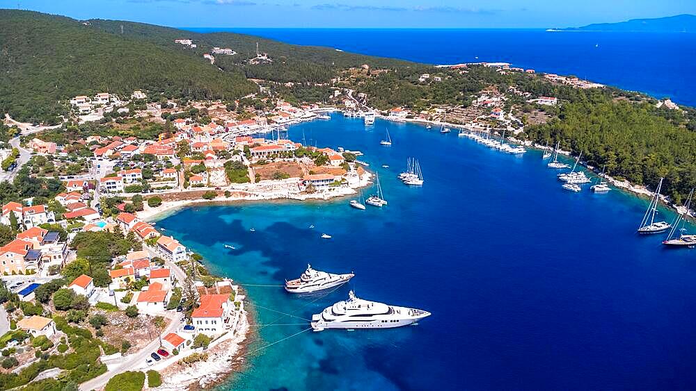 Aerial drone view of Fiskardo village port on Kefalonia island, Greece, Europe