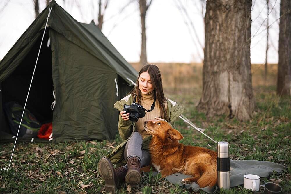 Woman sitting near tent