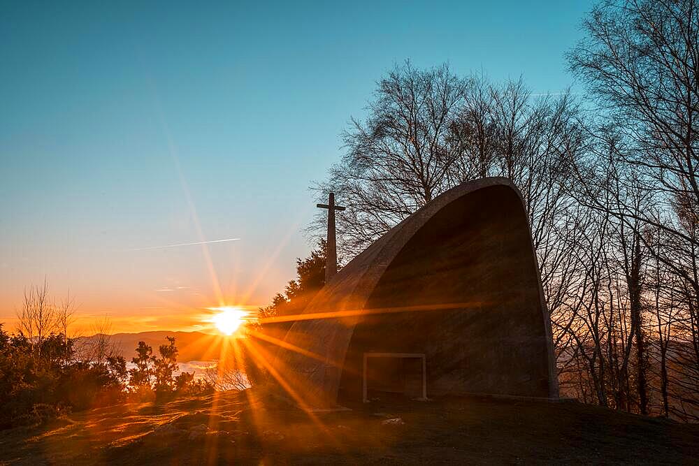 The sun rises in the beautiful hermitage of Agina one winter morning, Navarra. Basque Country