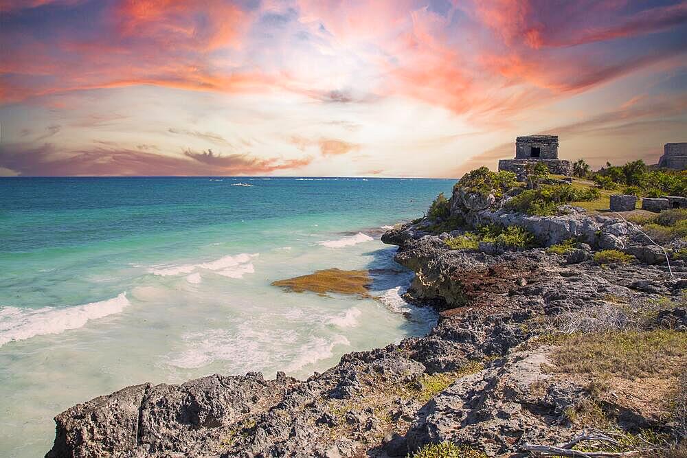 Sunset at the sea next to the Mayan temples of Tulum in Mexico