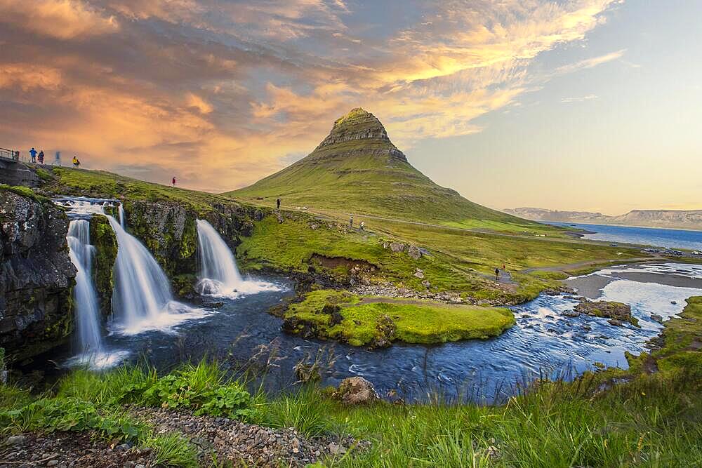 The beautiful sunset at Kirkjufell waterfall in Iceland