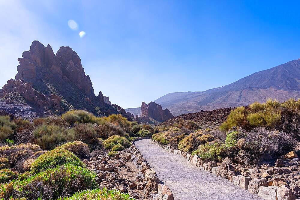 Beautiful path between the Roques de Gracia and the Roque Cinchado in the natural area of Teide in Tenerife, Canary Islands