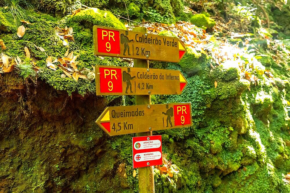 Signs on the trekking trail next to the waterfall in Levada do Caldeirao Verde, Queimadas, Madeira