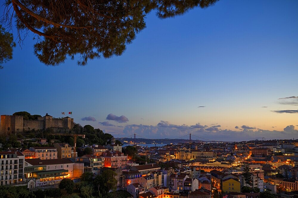 View from the viewpoint Miradouro da Graça, also Sophia de Mello Breyner Andresen, city view, old town, bridge 25 de Abril, river Tejo, Lisbon, evening mood, twilight, blue hour, Portugal, Europe