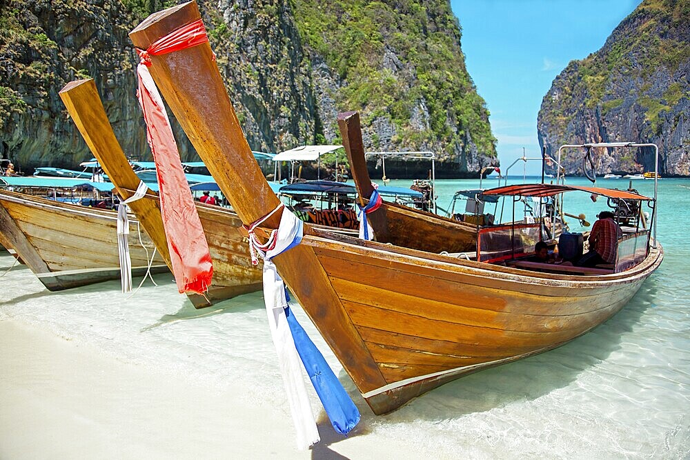 Long tail boats in the Maya Bay of Ko Phi Phi island Thailand