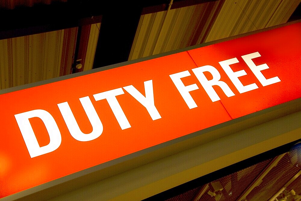 Red illuminated sign with the words duty free