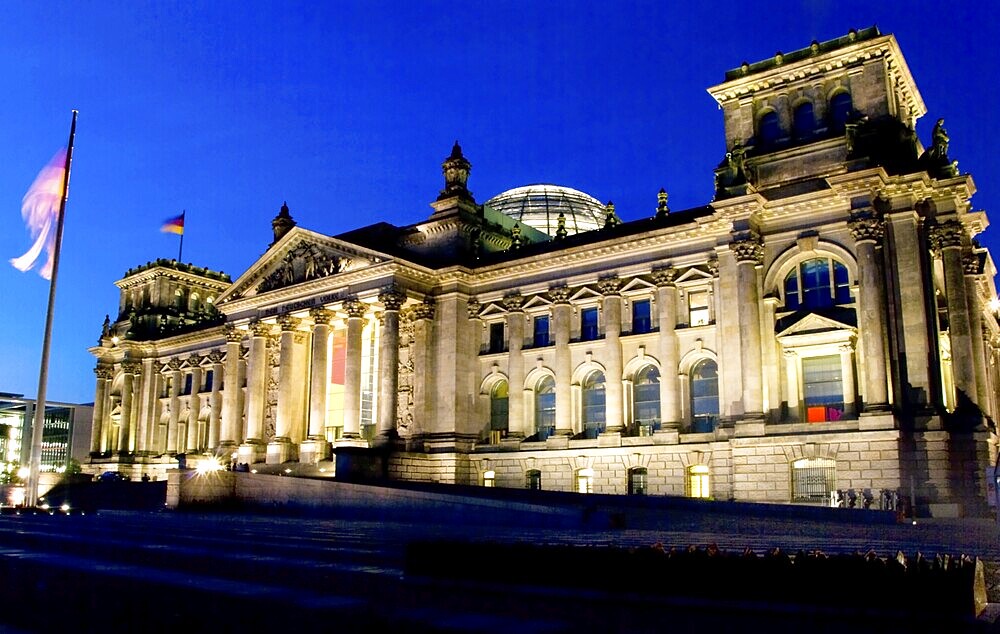 German reichstag building at night with dark blue sky