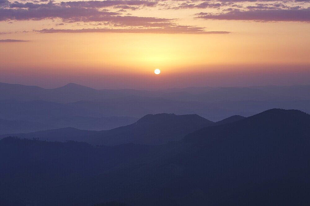 Rising sun under Carpathian mountains, Ukraine, Europe