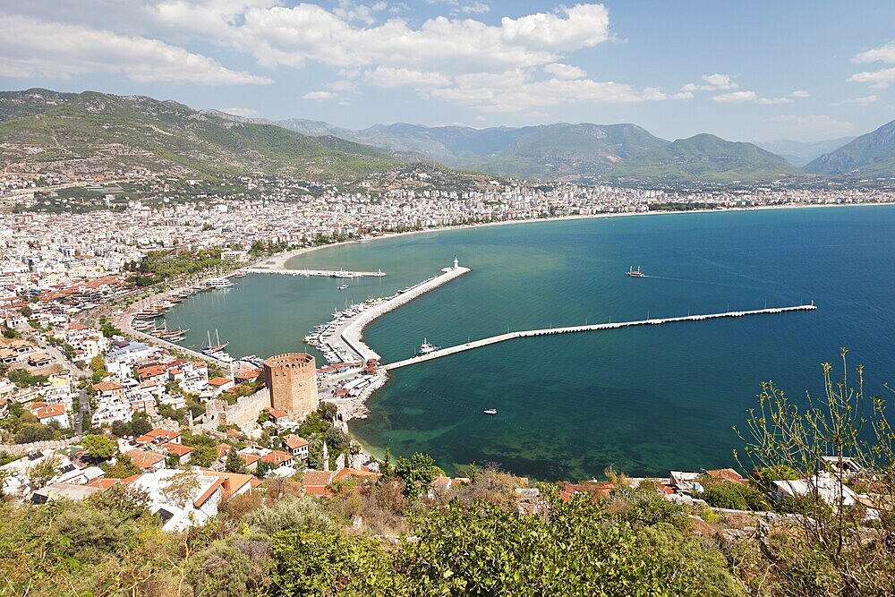 Summer vacations, blue Mediterranean sea and Turkey Alanya east coast beach resort with lighthouse and ship bay view from ancient mountain castle wall