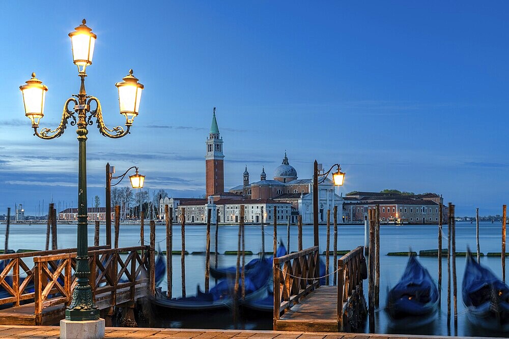 Gondolas in front of San Giorgio Maggiore in Venice at dawn