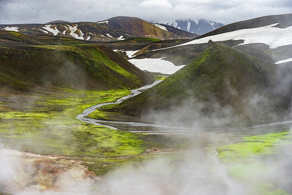 Colourful volcanic landscape with hills and snow, volcanic steaming hot springs, Laugavegur trekking trail, Landmannalaugar, Fjallabak Nature Reserve, Icelandic Highlands, Suðurland, Iceland, Europe