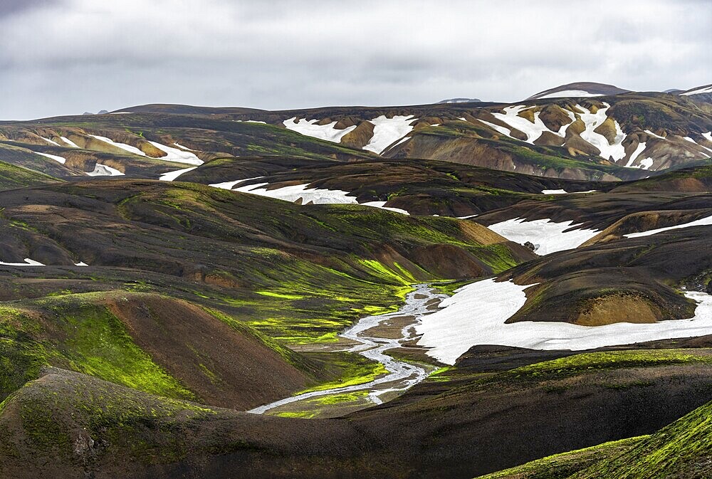 Colourful volcanic landscape with hills and snow, volcanic hot springs, Laugavegur trekking trail, Landmannalaugar, Fjallabak Nature Reserve, Icelandic Highlands, Suðurland, Iceland, Europe